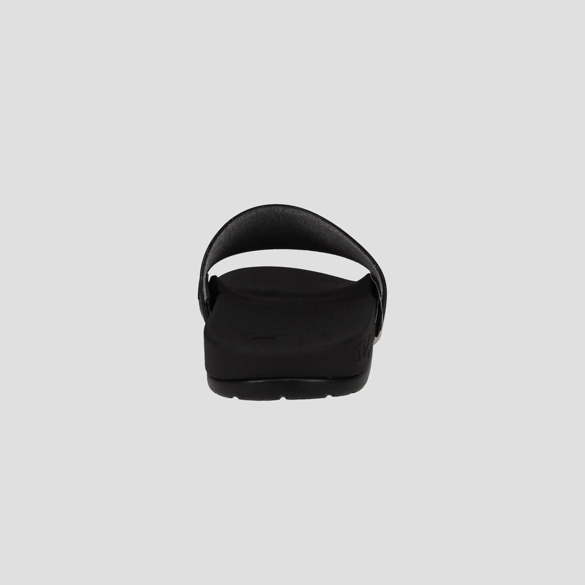 A black Champion Men's IPO Squish Slide sandal viewed from the back displays an open heel, curved strap, contoured footbed, and textured sole against a plain light gray background.