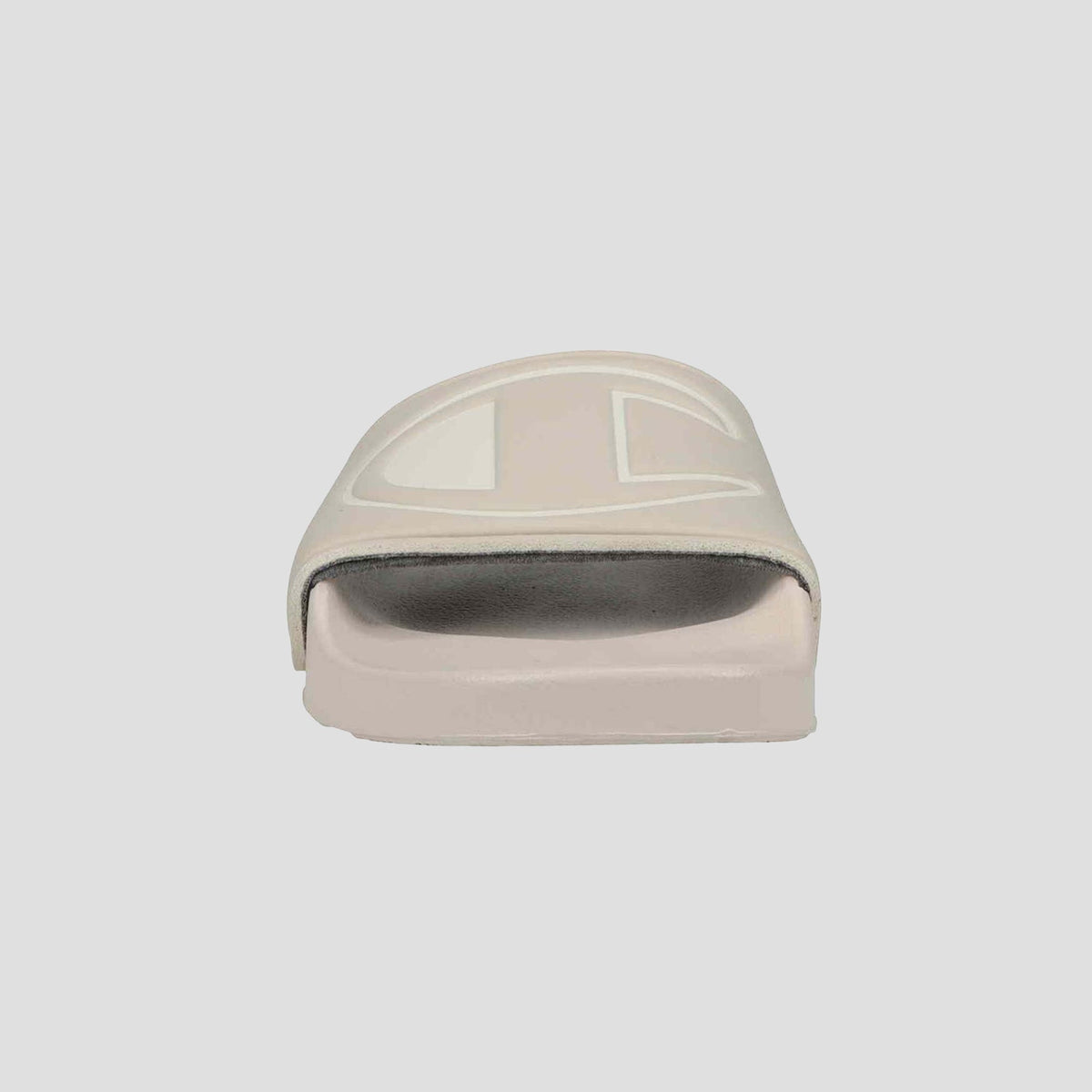 A front view of the Champion Women's IPO Slide in light beige, featuring a thick strap and slightly elevated sole with a contoured footbed for lightweight comfort, set against a plain white background.