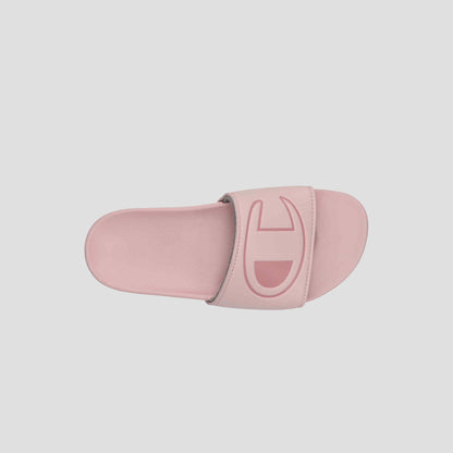 The Champion Women's IPO Slide is a pink slide sandal with a wide strap and large embossed logo. Viewed from above on a light background, its contoured footbed ensures extra comfort for supportive, stylish wear.