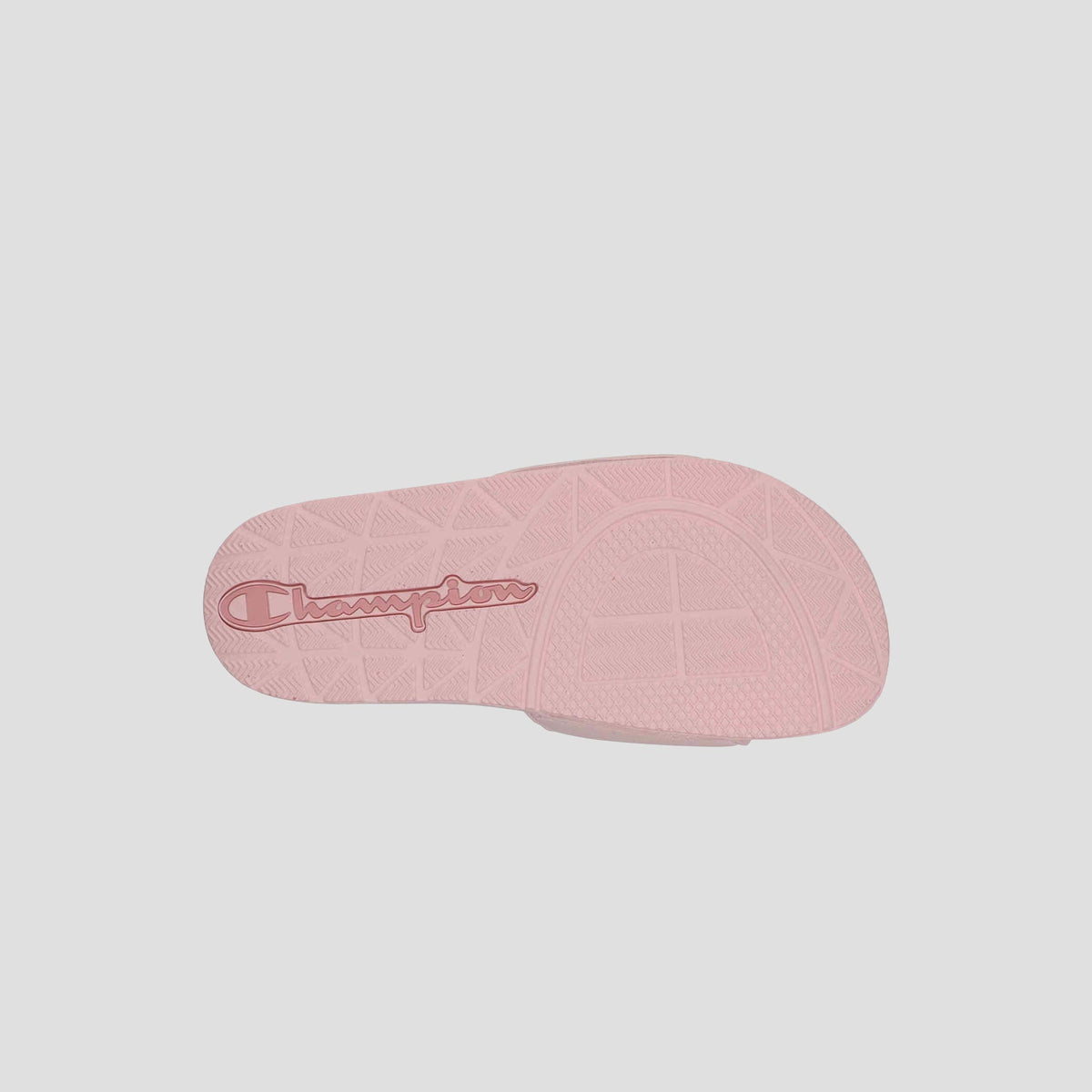 The Women's IPO Slide by Champion features a pink sole with "Champion" in red script, a textured grip pattern, and a contoured footbed for both style and comfort.