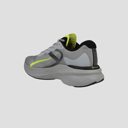 The Champion Men's Acceleron running shoe is shown at an angle on a light gray background, featuring gray uppers, neon yellow accents, black details, and a thick curved white sole.