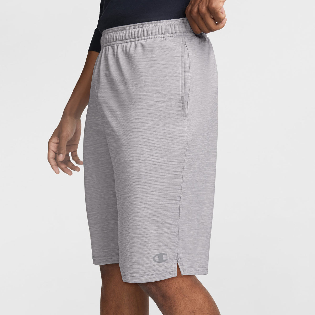 Light gray Champion 10″ Moisture Wicking, Sport Shorts featuring an elastic waistband, side pockets, and a small logo near the hem.