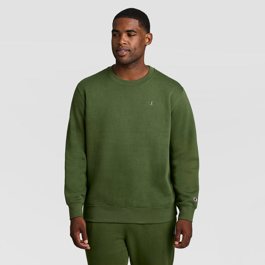 A man wearing an olive green Powerblend Crewneck Sweatshirt, C Logo - Big & Tall with a small logo on the chest and matching sweatpants.