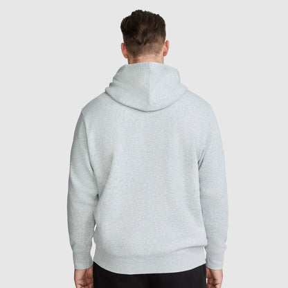 A man seen from behind wearing a light gray Champion Powerblend Hoodie, Full Script Logo - Big & Tall.