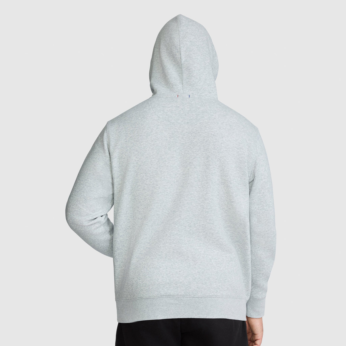 Back view of a gray midweight Champion Powerblend Hoodie, Full Script Logo - Big & Tall with a small logo detail at the base of the hood.