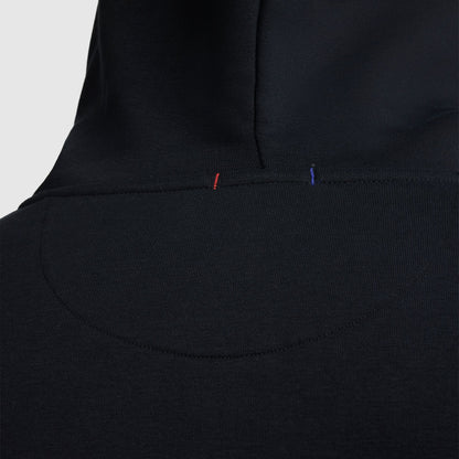 Close-up of the back of a Champion Powerblend Full-Zip Hoodie, C Logo – Big & Tall, highlighting detailed stitching with small red and blue thread accents near the neck area.