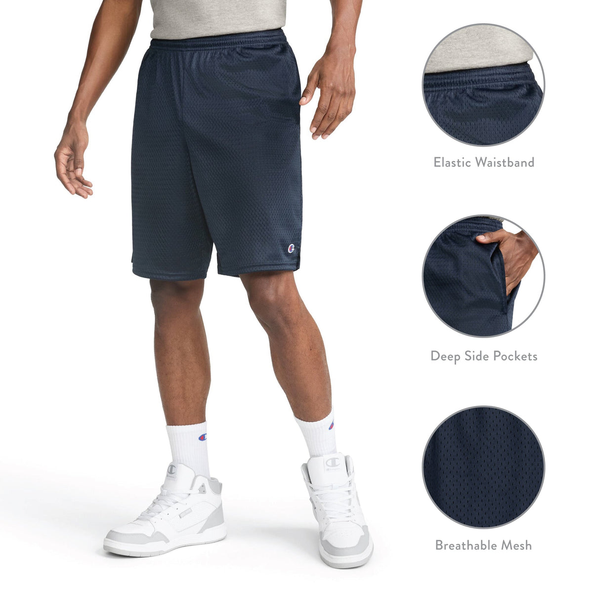 A person wears navy Champion 9″ Classic Mesh Shorts with an elastic waistband, deep side pockets, and white high-top sneakers. Three circular insets highlight the 9-inch inseam waistband, pocket, and breathable mesh fabric features inspired by Champion’s signature C Logo men’s mesh shorts.