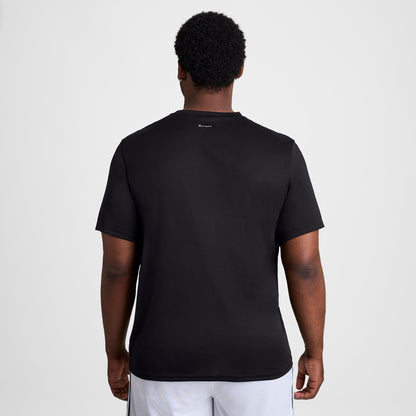 Back view of a person wearing a black Champion Sport T-Shirt, Reflective C Logo - Big & Tall, featuring a small reflective logo at the center of the neckline.