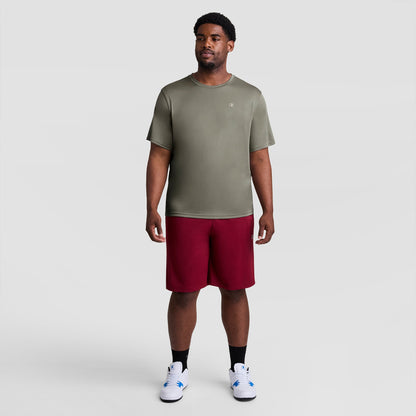 A man wearing an olive green Sport T-Shirt, Reflective C Logo - Big & Tall and maroon shorts.