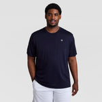A man wearing a black Sport T-Shirt, Reflective C Logo - Big & Tall with a small logo on the chest and white athletic shorts.