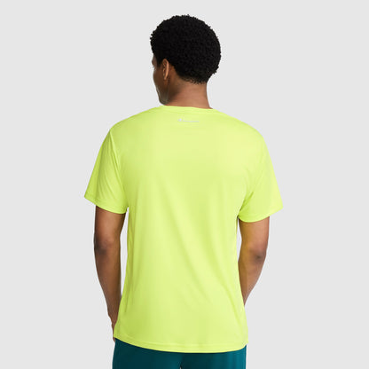 A person is shown from the back against a plain light gray background, wearing the Champion Sport T-Shirt with a reflective C logo. This bright yellow men’s athletic shirt features moisture-wicking fabric and a small white reflective Champion logo near the neckline.