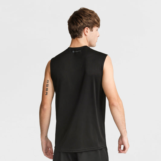 A young man with short brown hair is seen from behind in a plain, light setting, wearing the Champion Sport Muscle Tank with a Reflective C Logo and shorts. He has a vertical tattoo on his left upper arm.