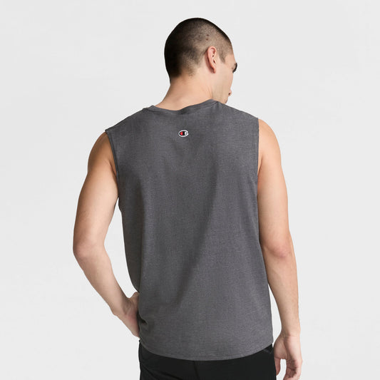 A man with short dark hair wears a Champion Muscle Tank, C Logo, and black shorts, standing with his back to the camera and looking right against a plain white background.