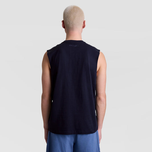 A person with short blond hair is shown from behind, wearing a black Champion Muscle Tank (C Logo) and blue shorts, standing against a plain light gray background.