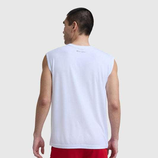 A man with short dark hair stands with his back to the camera, wearing a white Champion Sport Crewneck Muscle Tee, Script Logo, and red shorts against a plain light gray background.