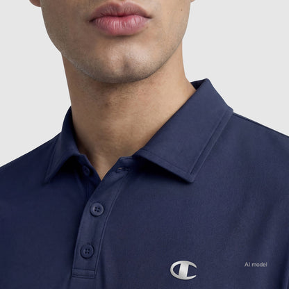A person is wearing the Champion Sport Polo, C Logo—a navy blue tri-blend shirt with buttons and a small white logo on the chest. Only the lower part of their face is visible; their eyes are not shown.