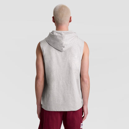 A person with short, light blonde hair stands with their back to the camera, wearing a Champion Sleeveless Hoodie with an Embroidered C Logo and burgundy shorts against a plain light gray background.