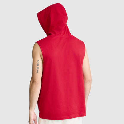 A person is seen from the back wearing a Champion Jersey Sleeveless Hoodie in red, featuring the signature C Logo and crafted from soft ring-spun cotton. The hood is up, and the individual has a vertical text tattoo on their upper left arm. The background is plain light gray.