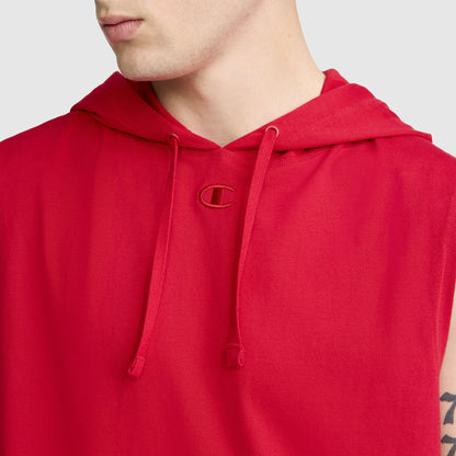 A person wearing the Champion Jersey Sleeveless Hoodie, featuring the C Logo on the chest and adjustable drawstrings. Made from soft ring-spun cotton, this red hoodie reveals only their lower face, neck, and upper torso.