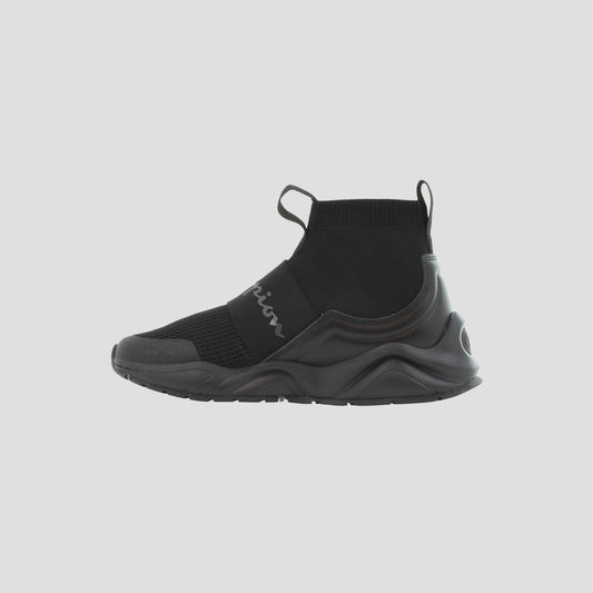 The Champion Kids' Rally Pro sneakers feature a black knit design, high sock-like ankle collar, front and back pull tabs, and Champion cursive on the side strap. Thick wavy soles ensure comfort for all-day play.