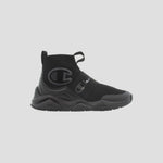 The Champion Kids' Rally Pro is a black slip-on athletic sneaker featuring a thick sole, mesh upper, elastic strap, and Champion logos—ideal comfortable footwear for everyday play.