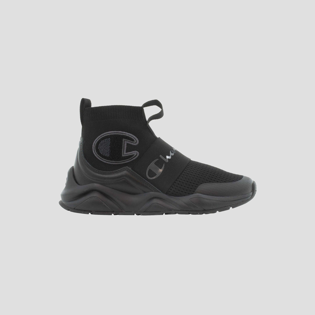 The Champion Kids' Rally Pro is a black slip-on athletic sneaker featuring a thick sole, mesh upper, elastic strap, and Champion logos—ideal comfortable footwear for everyday play.