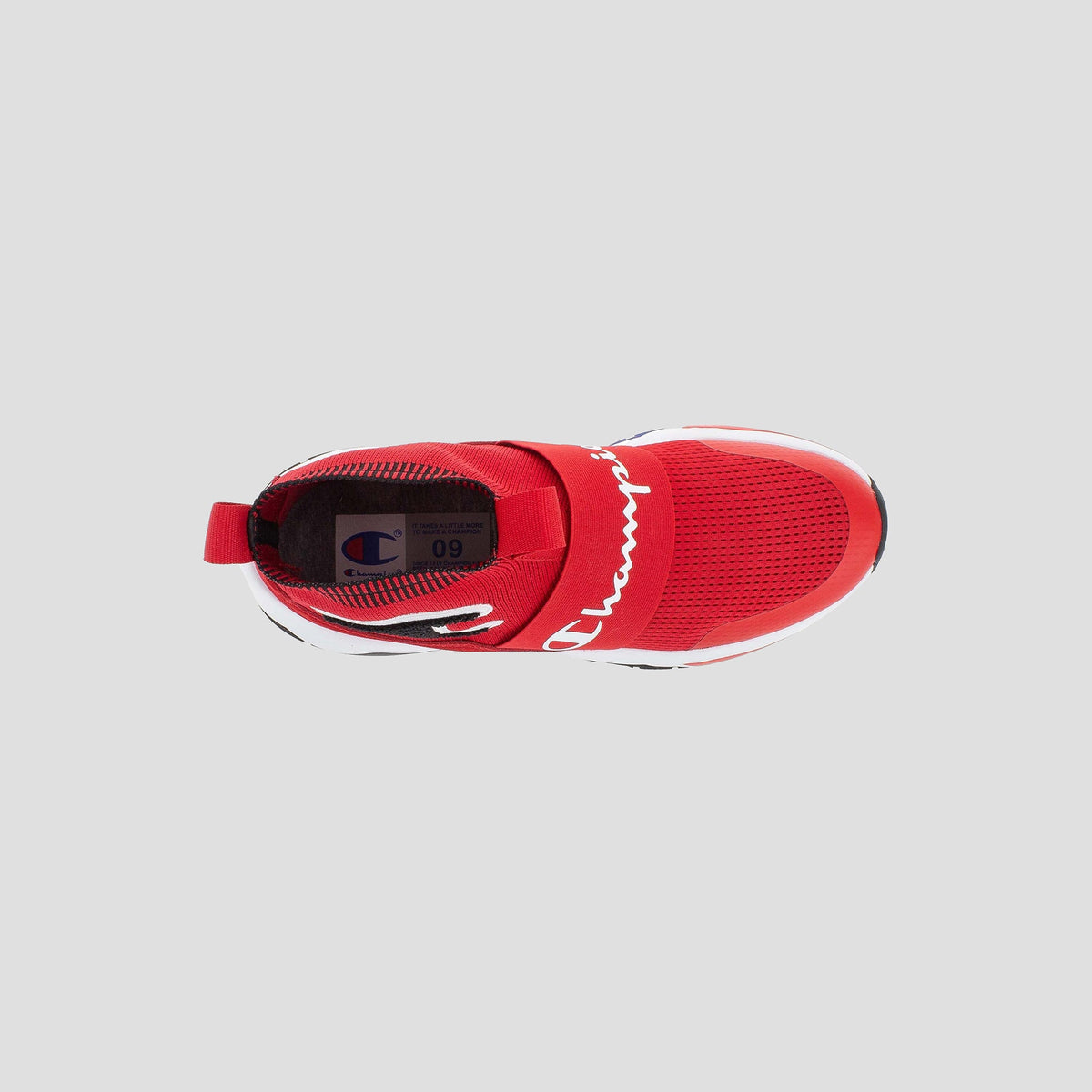 Top view of the Champion Kids' Rally Pro sneaker in red, featuring a white Champion logo strap across the midfoot, mesh upper, white sole, and insole with Champion branding and size details.
