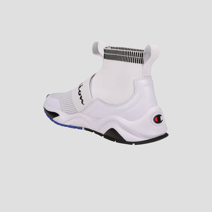 The Champion Men's Rally Pro sneaker in white features a sock-style ankle, high collar, black and blue sole accents, and a Champion logo on the heel, shown from a rear side angle against a plain background.