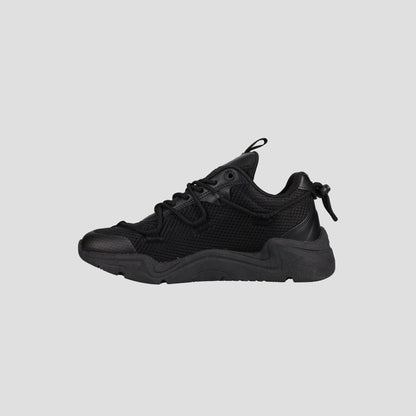 The Champion Men's Hyper C Pilot W is a black lifestyle sneaker featuring a durable mesh upper, leather accents, thick textured sole, lace-up front, and heel pull tab, shown on a plain light gray background.