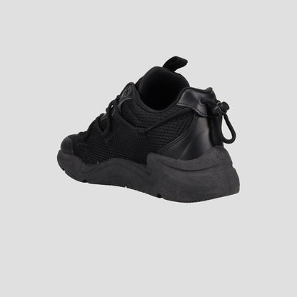 The Champion Men's Hyper C Pilot W is a black lifestyle sneaker featuring a chunky sole, durable mesh upper, and synthetic overlays, shown from the back and side on a light gray background.