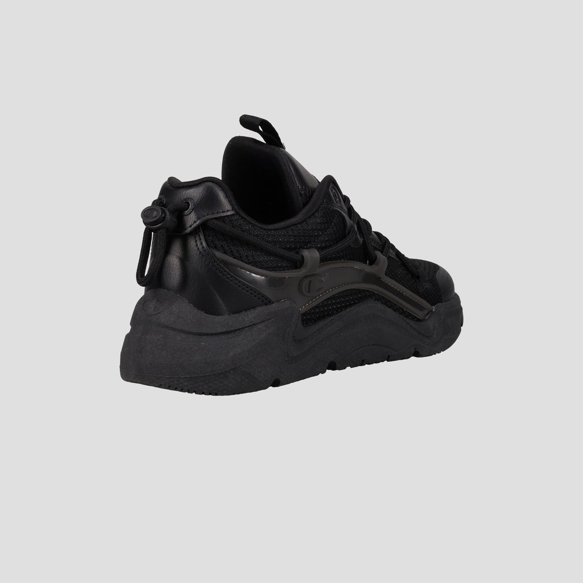 The Champion Men's Hyper C Pilot W is a black lifestyle sneaker with a chunky sole, durable mesh upper, and leather details, shown from a rear angled view against a plain gray background.