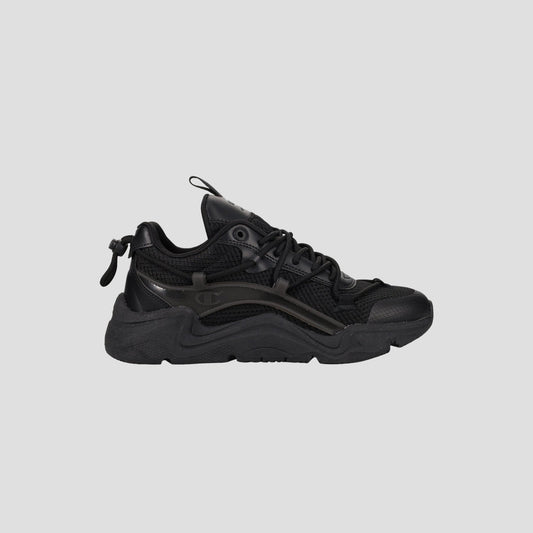 The Champion Men's Hyper C Pilot W is a black lifestyle sneaker with a chunky sole, mesh upper, synthetic overlays, lace-up front, and pull tab at the heel, shown in side profile against a plain light gray background.