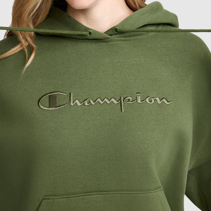 A person wearing a Tonal Script Freshman Powerblend Hoodie by Champion in olive green, featuring the brand's tonal script logo embroidered across the chest. Only their lower face and upper torso are visible, showcasing the classic style of this women's Champion sweatshirt.