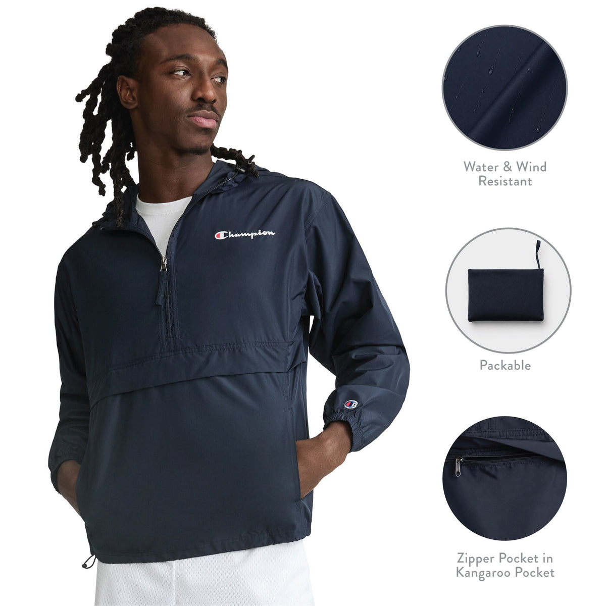 A man wears the Champion Stadium Packable Jacket in navy, featuring a quarter-zip design. Insets highlight its wind- and water-resistant properties, convenient packability, and a zippered pocket within the kangaroo pouch. The jacket displays the Champion script logo on the chest and sleeve.