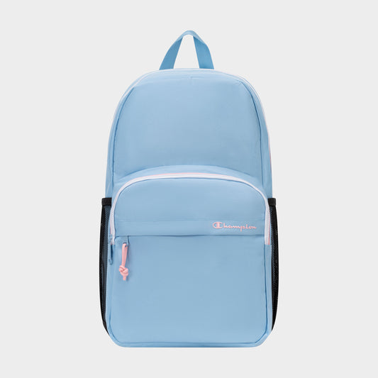 The Champion Luna Backpack is a light blue everyday backpack featuring a front zip pocket, pink zipper pulls, black side mesh pockets, and a top handle. Designed for convenience, it includes an interior laptop sleeve and showcases the word "Champion" embroidered in white and pink on the front pocket. This minimalist backpack blends style with functionality for daily use.