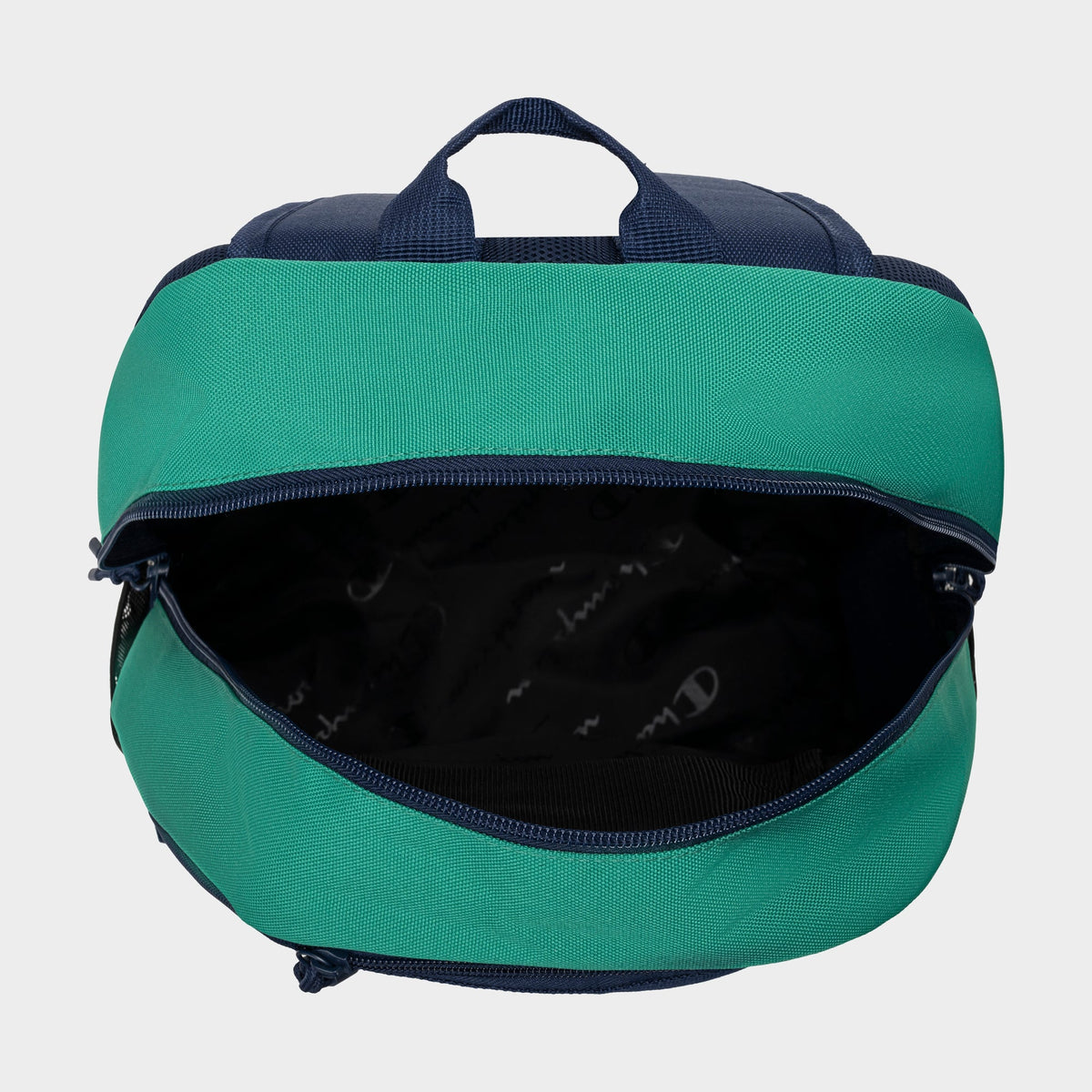 A top-down view of the Champion Kid's Bungee Backpack in green and navy with a zippered main compartment and empty black lining—this durable backpack is perfect for kids' sports.