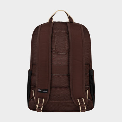 A back view of the Champion Level Backpack in brown showcases its padded shoulder straps, beige carrying handle, a small Champion logo near the bottom left strap, and a padded laptop sleeve for organized and protected everyday essentials.