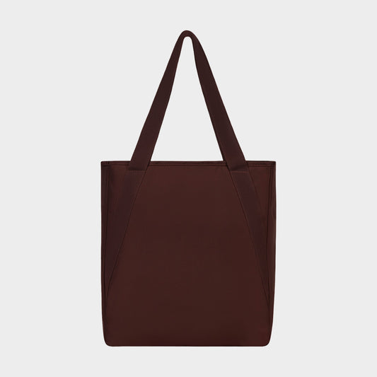 A durable nylon Champion Lottie Tote in plain dark brown, featuring two handles and displayed against a white background—an everyday essential.