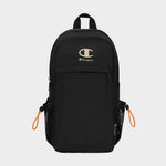 Introducing the Champion Camden Sling, a black backpack crafted from durable nylon sling material. Featuring a prominent white Champion logo on the front, eye-catching orange zipper pulls, two side mesh pockets, and a top handle, this bag includes an adjustable strap for personalized comfort. Inspired by the sleek design of the original Camden Sling, it is displayed against a plain white background.