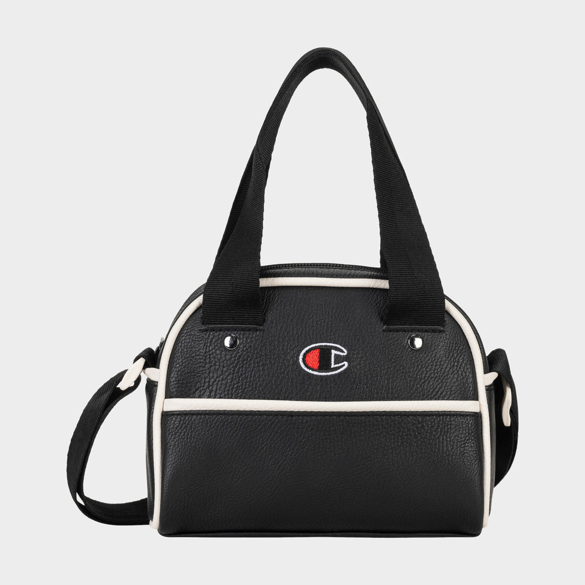 Hudson Mini Bowler Bag: This compact black handbag by Champion features white trim, dual handles, and an adjustable strap for versatile carrying options. The front displays the iconic Champion logo with a red, white, and blue “C.” The Hudson Mini Bowler Bag offers a zippered top closure, a convenient front pocket, and an interior zip pocket to keep your essentials organized.
