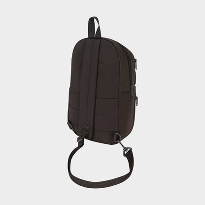 A Champion Explore Sling backpack in black, displayed from the back against a plain white background. This bag features a top handle, adjustable shoulder strap, secure zipper closures, and a sleek minimalist design—ideal for compact carrying when you want to travel light.