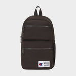 Introducing the Champion Explore Sling—a compact black sling bag featuring two front zippered pockets, a mesh side pocket, and a white Champion logo patch on the lower front. Designed for those who prefer to travel light, this sleek carry includes a top handle and black zippers, blending practical everyday utility with classic Champion style.