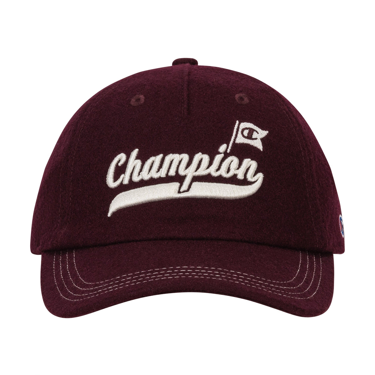 The Champion Sophomore Adjustable Cap is a maroon collegiate-style hat with white stitching, "Champion" embroidered on the front, a small flag logo, and crafted from soft faux wool.
