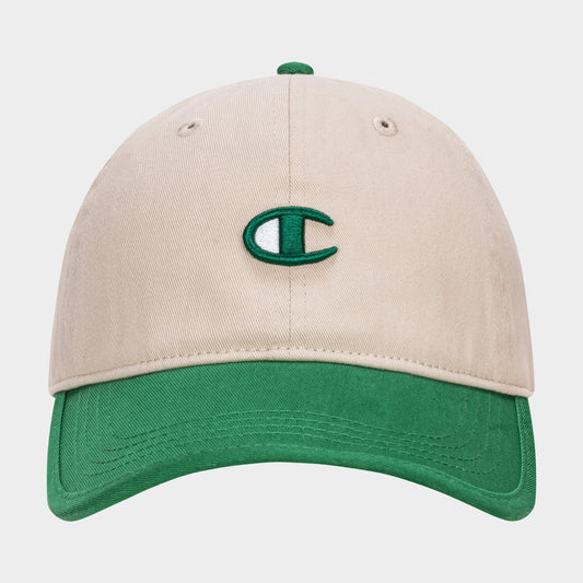 The Champion Briggs Washed Cotton Twill Adjustable Baseball Cap features a beige design with a green brim and a green and white embroidered C logo, crafted from washed cotton twill and shown on a plain white background.