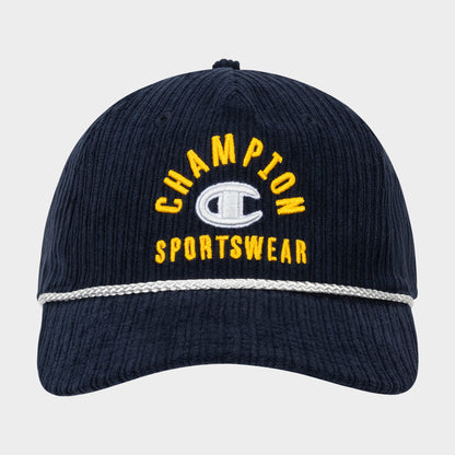 The Stephen Adjustable Cap by Champion is a navy blue corduroy cap featuring “CHAMPION SPORTSWEAR” embroidered in yellow and white letters on the front, a silver band across the visor, and an adjustable snapback closure for a comfortable fit.