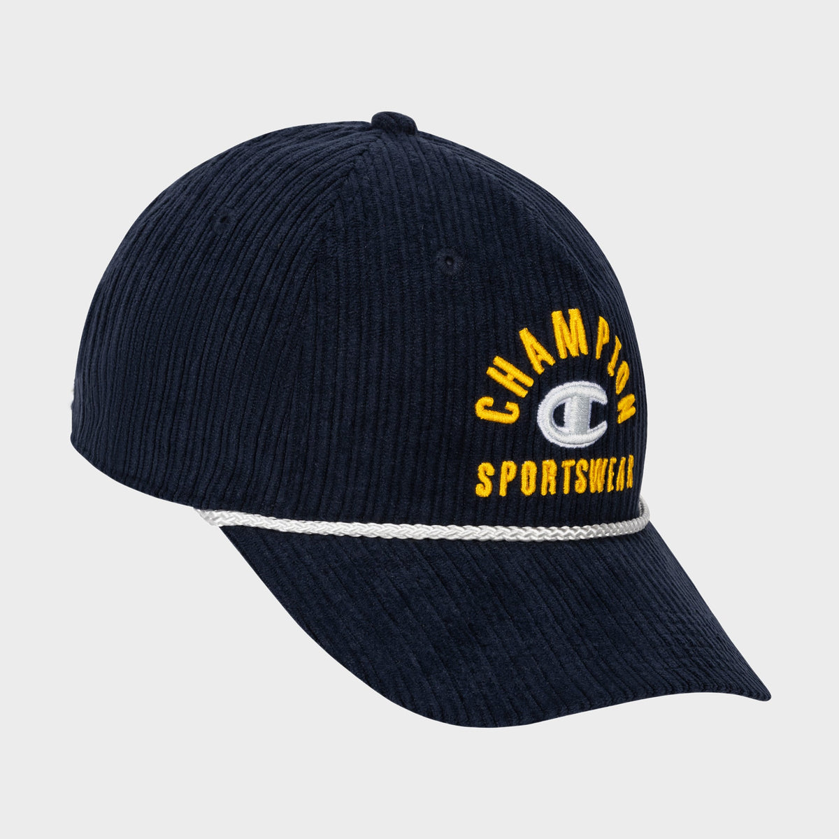 Introducing the Stephen Adjustable Cap by Champion—a navy blue ribbed corduroy cap with “Champion Sportswear” embroidered in yellow and white on the front. It features a white cord above the visor and an adjustable snapback closure for a customizable fit.