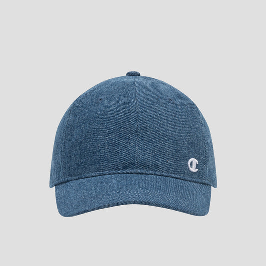 The Glen Denim Adjustable Baseball Cap by Champion is a blue denim hat featuring a curved brim and a small white embroidered C logo on the front, shown against a plain light gray background. This adjustable cap blends everyday comfort with signature Champion branding for casual style.
