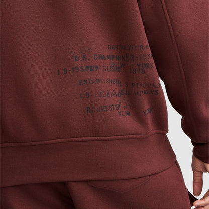 Champion fleece baseball jacket in dark red with distressed black text on the front reading Rochester New York and Established 1919.