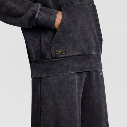 Champion Mineral Wash Pullover Hoodie, C Patch Logo in black mineral wash vintage style with a kangaroo pocket and a rectangular patch logo near the hem.