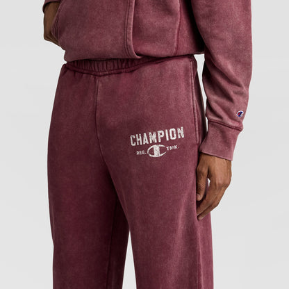 Maroon mineral-wash Champion Mineral Wash Open Hem Pant featuring the brand name and logo printed on the thigh.